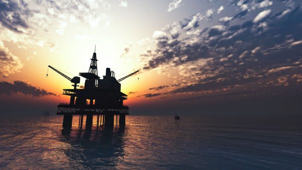 oil-drill-rig-platform-on-the-sea-sunrise-B8TV9UE