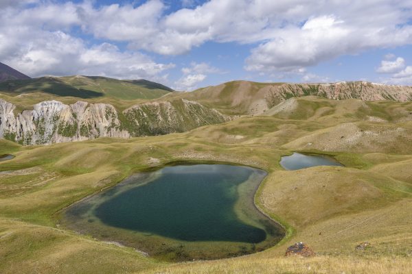 Landscape view with lakes in a valley surrounded by mountains, Tulpar Kul, Kyrgyzstan.