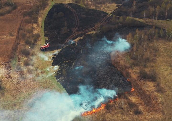 Drought Bush Fire And Smoke. Fire Engine, Truck On Firefighting Operation. Wild Open Fire Destroys Grass. 4K Aerial View Spring Dry Grass Burns During Drought Hot Weather. Bush Fire And Smoke