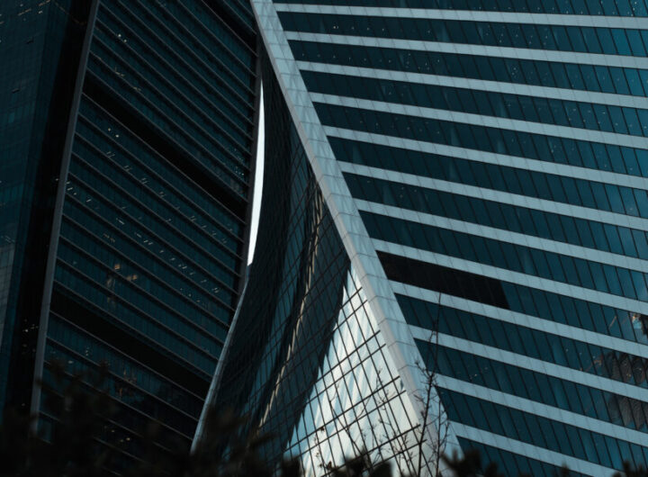 Close-up modern architecture, high-rise buildings swirling in a spiral, business financial center, office skyscrapers exterior