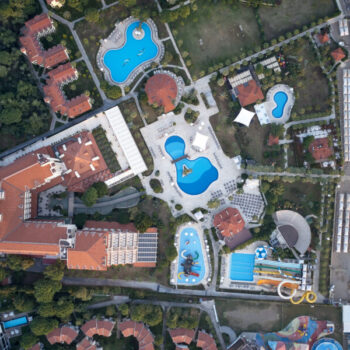 Aerial view of water park and coastline of resort hotel.